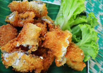 fried fish crispy fillet with bread crumb and vegetable