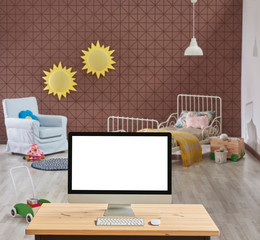 Brown young child room background, close up desktop screen on the wooden desk.
