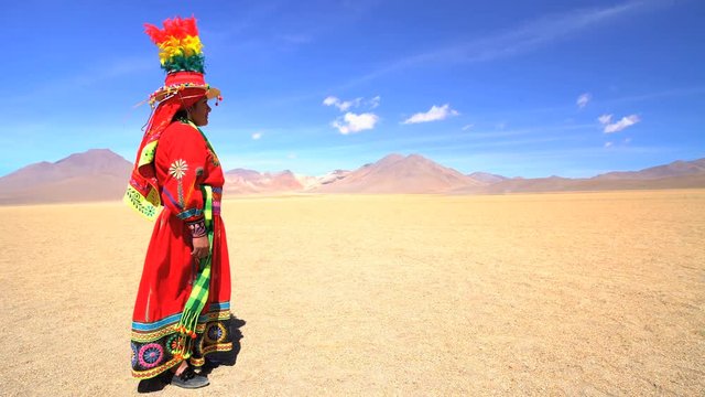 Bolivian female in Eduardo Avaroa National Reserve Salvador Dali desert wearing traditional headdress and National costume South America Wilderness 