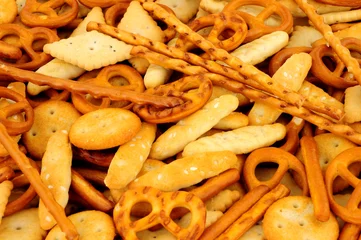 Foto op Plexiglas Savoury pretzel and cracker snack mix background © philip kinsey