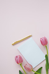 blank pad with tulips on pink background