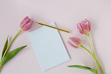 blank white card with pink tulips