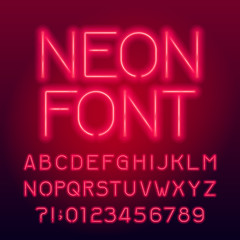 Red neon tube alphabet font. Neon color uppercase letters and numbers. Stock vector typography for your design.