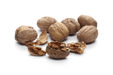 Cracked walnuts, isolated on white background