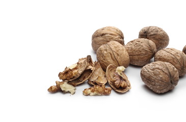 Cracked walnuts, isolated on white background