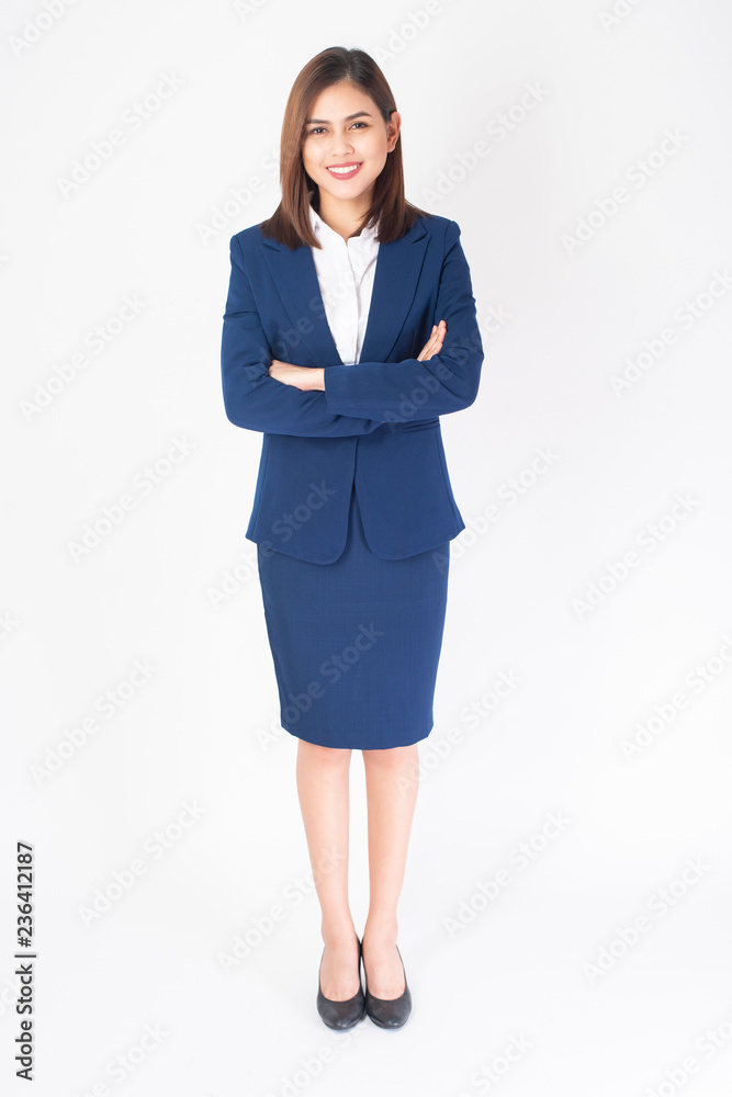 Wall mural Beautiful Business Woman in blue suit is smiling on white  background