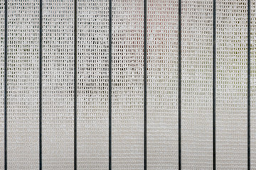 Closeup of a cloth background with wire rods