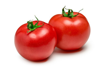 Tomatoes isolated on white background. Two fresh raw vegetables