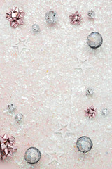 pink glitter background with silver ornament
