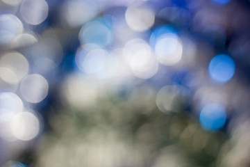 Abstract christmas background, blue colored and blurred.