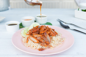 Barbecued red pork in sauce with rice