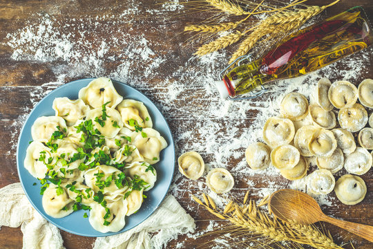 Tasty cooking and raw homemade meat dumplings or traditional italian ravioli
