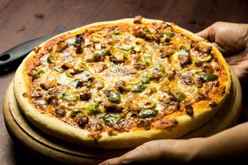 Pan Pizza take from side closeup hold hands