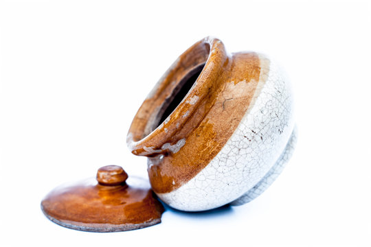 Close up of ceramic pickle container isolated on white i.e. achar ki barni isolated.;