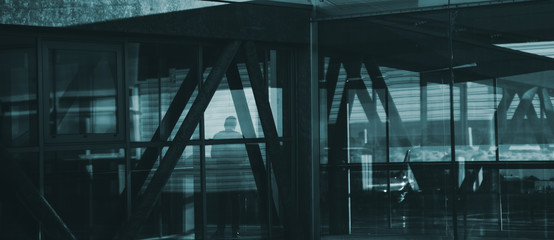 silhouette of a man in modern structures airport modern abstract architectures.