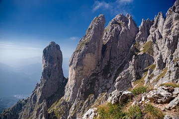 Panoramic view of the towers and spiers of the southern Grigna from the direct route, on a sunny autumn day.