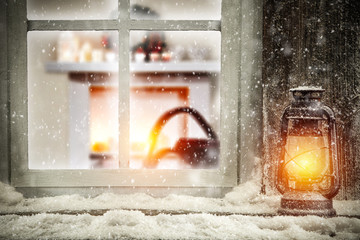 christmas lamp and snow decoration on window sill 