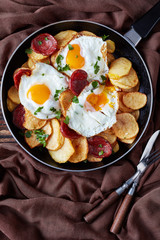 fried potatoes, eggs and chorizo, vertical view