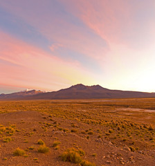 Fototapeta premium Sunset in Andes. Parinacota volcano. High Andean landscape in the Andes.