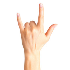 Female hand showing rock n roll sign or giving the devil horns gesture