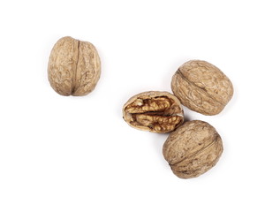 Cracked walnuts, isolated on white background, top view