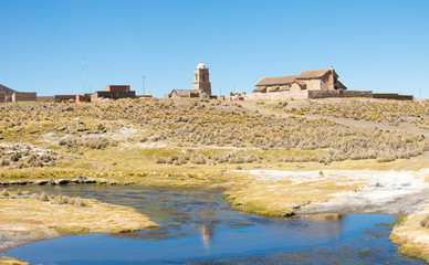 The small Andean town of Sajama, from the bank of the Sajama river. Bolivian Altiplano. Bolivia, South America
