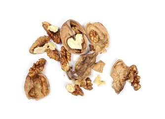 Cracked walnuts, isolated on white background, top view
