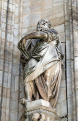 Obraz premium Statue of Saint on the facade of the Milan Cathedral, Duomo di Santa Maria Nascente, Milan, Lombardy, Italy