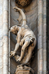 Statue of Saint on the facade of the Milan Cathedral, Duomo di Santa Maria Nascente, Milan, Lombardy, Italy