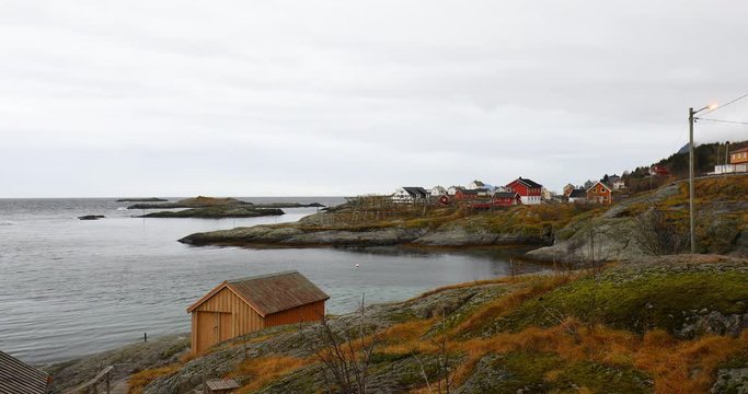 typical norwegian houses at ocean side at Tind, Sorvagen at Lofoten on cloudy day