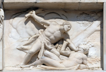 Cain killing Abel, marble relief on the facade of the Milan Cathedral, Duomo di Santa Maria...