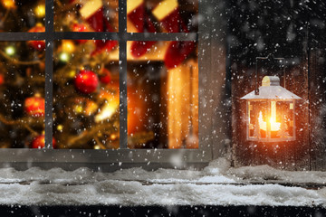 Christmas window sill of snow and ice and home interior 