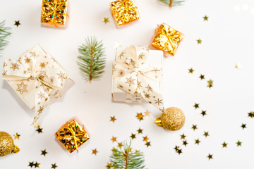 Christmas composition. Christmas golden decor, pine cone, star on white background. Flat lay, top view, copy space