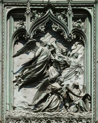 Angels, detail of the main bronze door of the Milan Cathedral, Duomo di Santa Maria Nascente, Milan, Lombardy, Italy