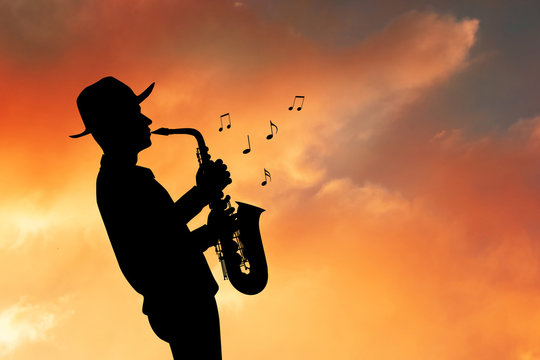 saxophonist man silhouette at sunset