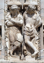 Atlantes supporting the main facade of the Milan Cathedral, Duomo di Santa Maria Nascente, Milan, Lombardy, Italy