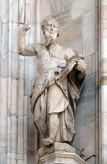 Fototapeta premium Statue of Saint on the facade of the Milan Cathedral, Duomo di Santa Maria Nascente, Milan, Lombardy, Italy