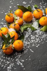 Close up photo of tangerines on black table
