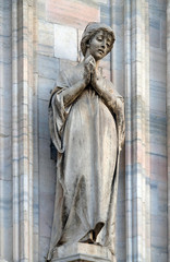 Obraz premium Saint Savina of Milan, statue on the Milan Cathedral, Duomo di Santa Maria Nascente, Milan, Lombardy, Italy