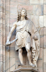 Obraz premium Statue of Saint on the facade of the Milan Cathedral, Duomo di Santa Maria Nascente, Milan, Lombardy, Italy
