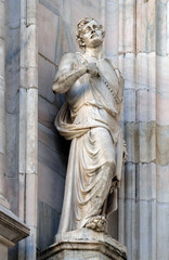 Obraz premium Statue of Saint on the facade of the Milan Cathedral, Duomo di Santa Maria Nascente, Milan, Lombardy, Italy