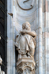 Fototapeta premium Statue of Saint on the facade of the Milan Cathedral, Duomo di Santa Maria Nascente, Milan, Lombardy, Italy