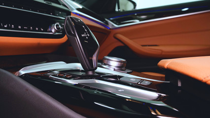Fototapeta premium Closely shown are different parts of the car interior. Concept from: Car Garage, Glass lifts, Steering part, After dry cleaning, Absolutely new, New Generation Car.