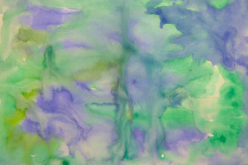 Abstract watercolor stains of yellow and green color. Color blur on paper. Abstraction in green...