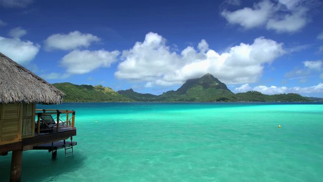 Mt Otemanu and overwater bungalows in a luxury tropical Tahitian vacation resort on Bora Bora Island in the South Pacific