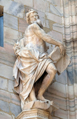 Obraz premium Statue of Saint on the facade of the Milan Cathedral, Duomo di Santa Maria Nascente, Milan, Lombardy, Italy