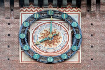 Clock on the Sforza Castle in Milano, Italy, built in the 15th century by Francesco Sforza, Duke of Milan, on the remnants of a 14th-century fortification
