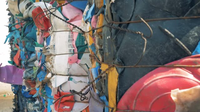 Many stacks of plastic garbage, close up.