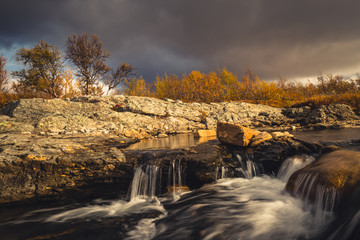 Waterfalls on mountain stream. Autumn in Sylan mountains in Norway.