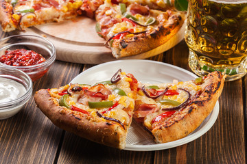 Slices of pizza with bacon, paprika and corn